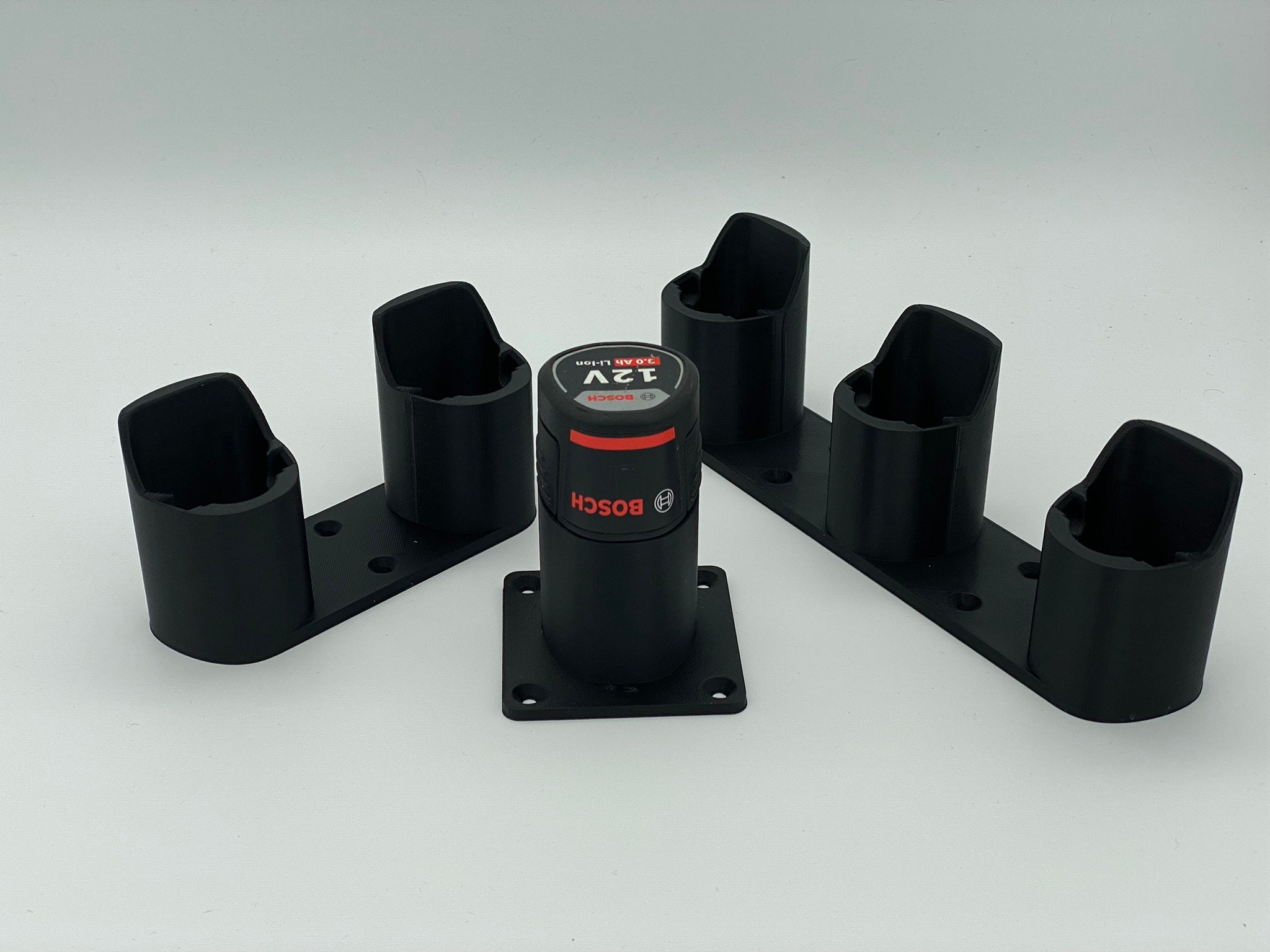 il_fullxfull.5567181109_kwso.jpg Bosch 12V Battery Holder Wall Mount: 3D Printed Tool Organizer - Image 1